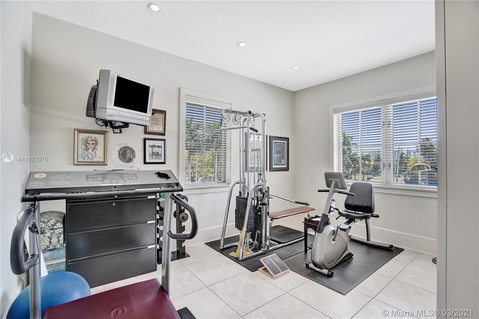 3014 Pine Tree Drive Miami Beach, FL 33140 - Photo 26 of 43 a view of a workspace with furniture and a window
