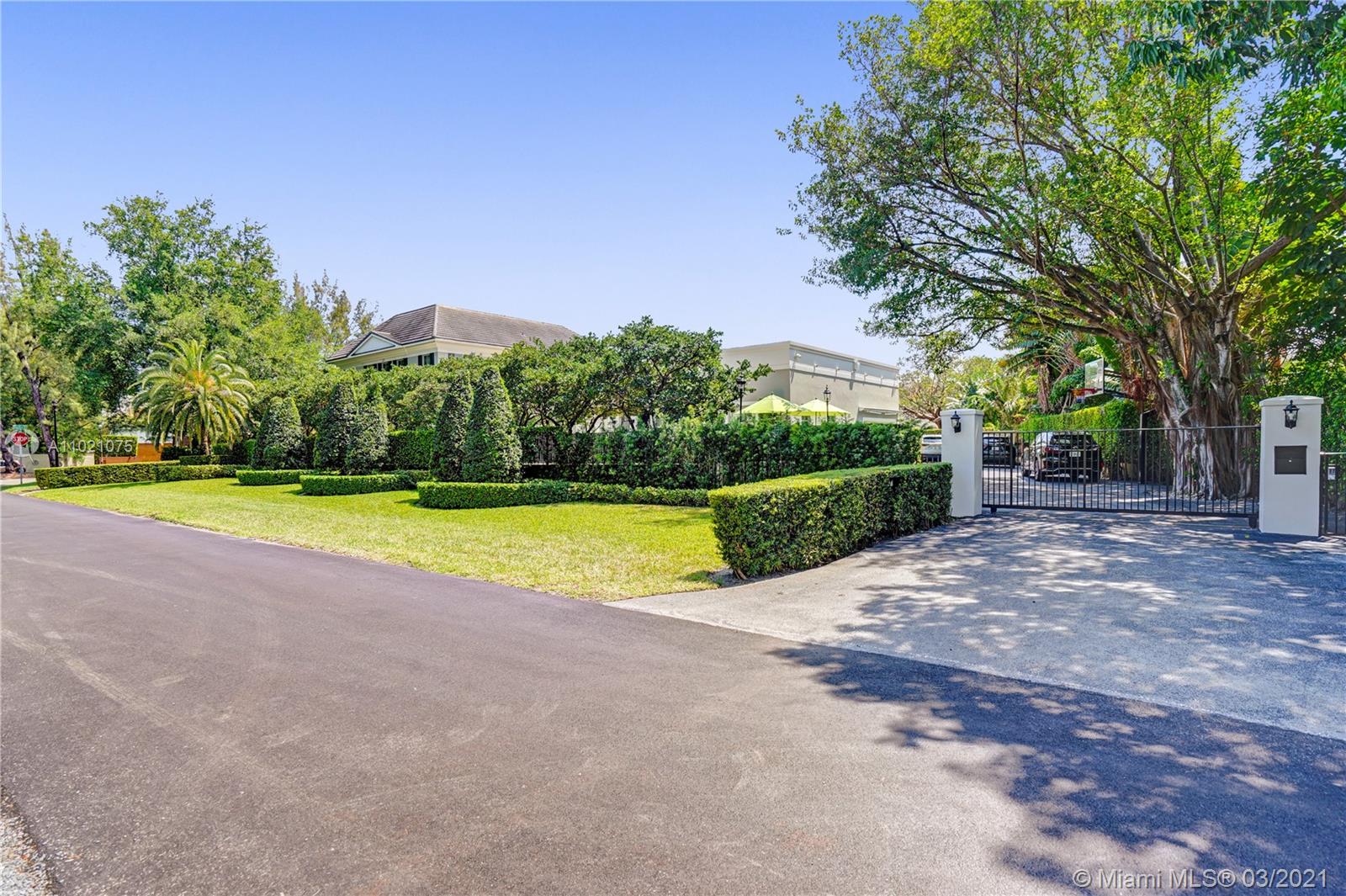 3014 Pine Tree Drive Miami Beach, FL 33140 - Photo 35 of 43 a view of a house with a big yard