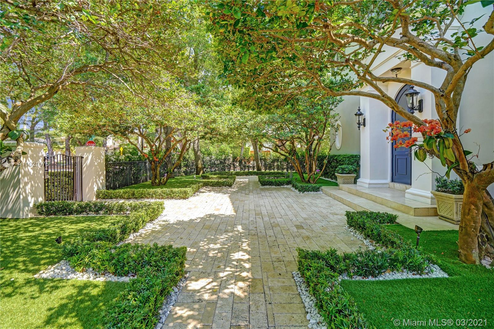 3014 Pine Tree Drive Miami Beach, FL 33140 - Photo 36 of 43 a view of a house with a yard and tree s