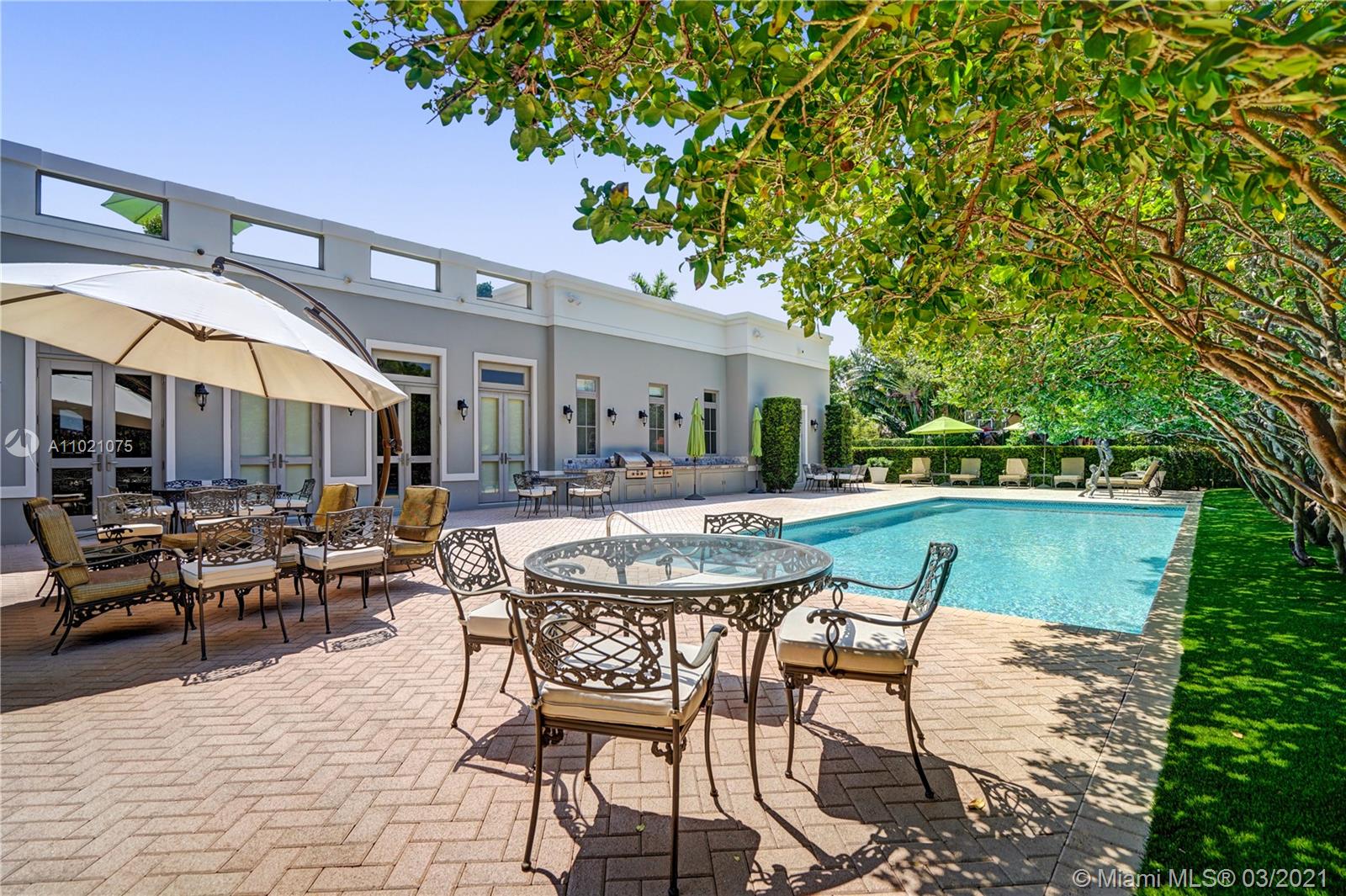 3014 Pine Tree Drive Miami Beach, FL 33140 - Photo 38 of 43 a swimming pool with outdoor seating and yard