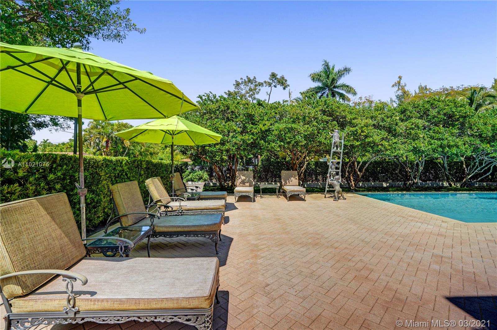 3014 Pine Tree Drive Miami Beach, FL 33140 - Photo 40 of 43 a backyard view with a seating space