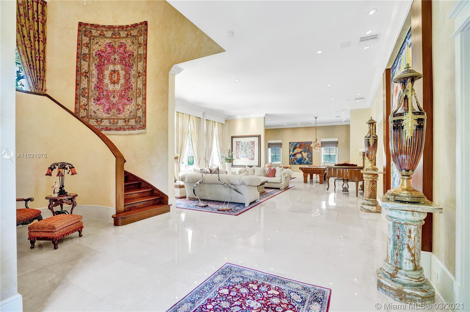 3014 Pine Tree Drive Miami Beach, FL 33140 - Photo 5 of 43 a living room with furniture and a painting
