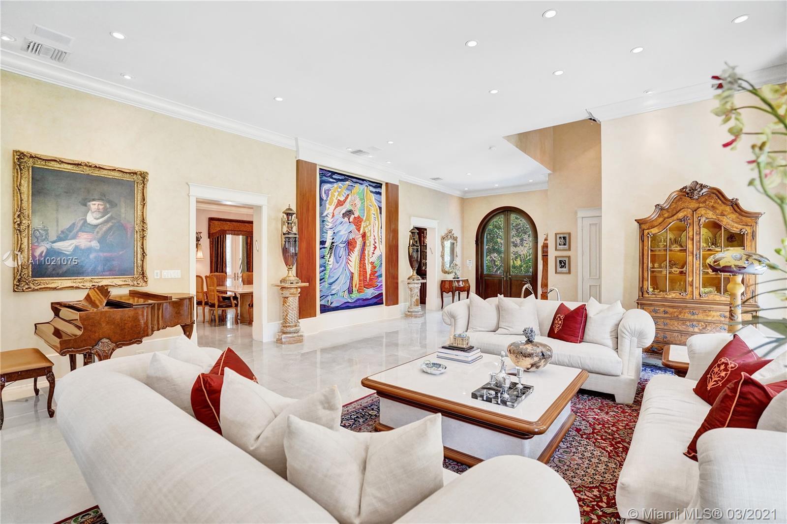 3014 Pine Tree Drive Miami Beach, FL 33140 - Photo 6 of 43 a living room with furniture and wooden floor