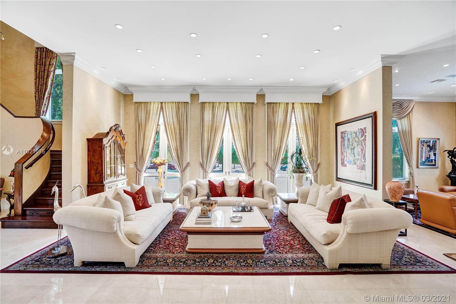 3014 Pine Tree Drive Miami Beach, FL 33140 - Photo 7 of 43 a living room with fireplace furniture and a large window