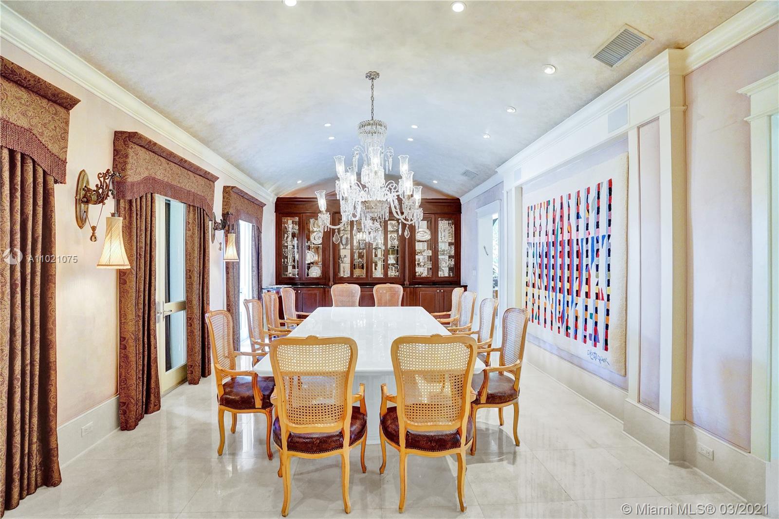 3014 Pine Tree Drive Miami Beach, FL 33140 - Photo 8 of 43 a view of a dining room with furniture window and outside view
