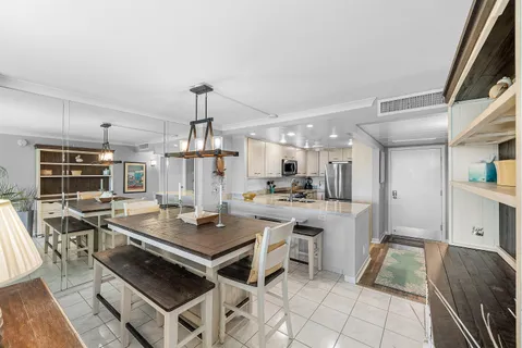 a spacious en suite bathroom with a double vanity sink and a mirror