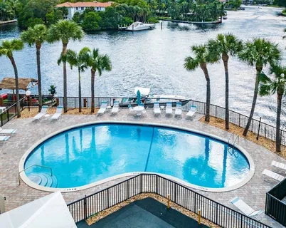 a view of a swimming pool with an outdoor seating