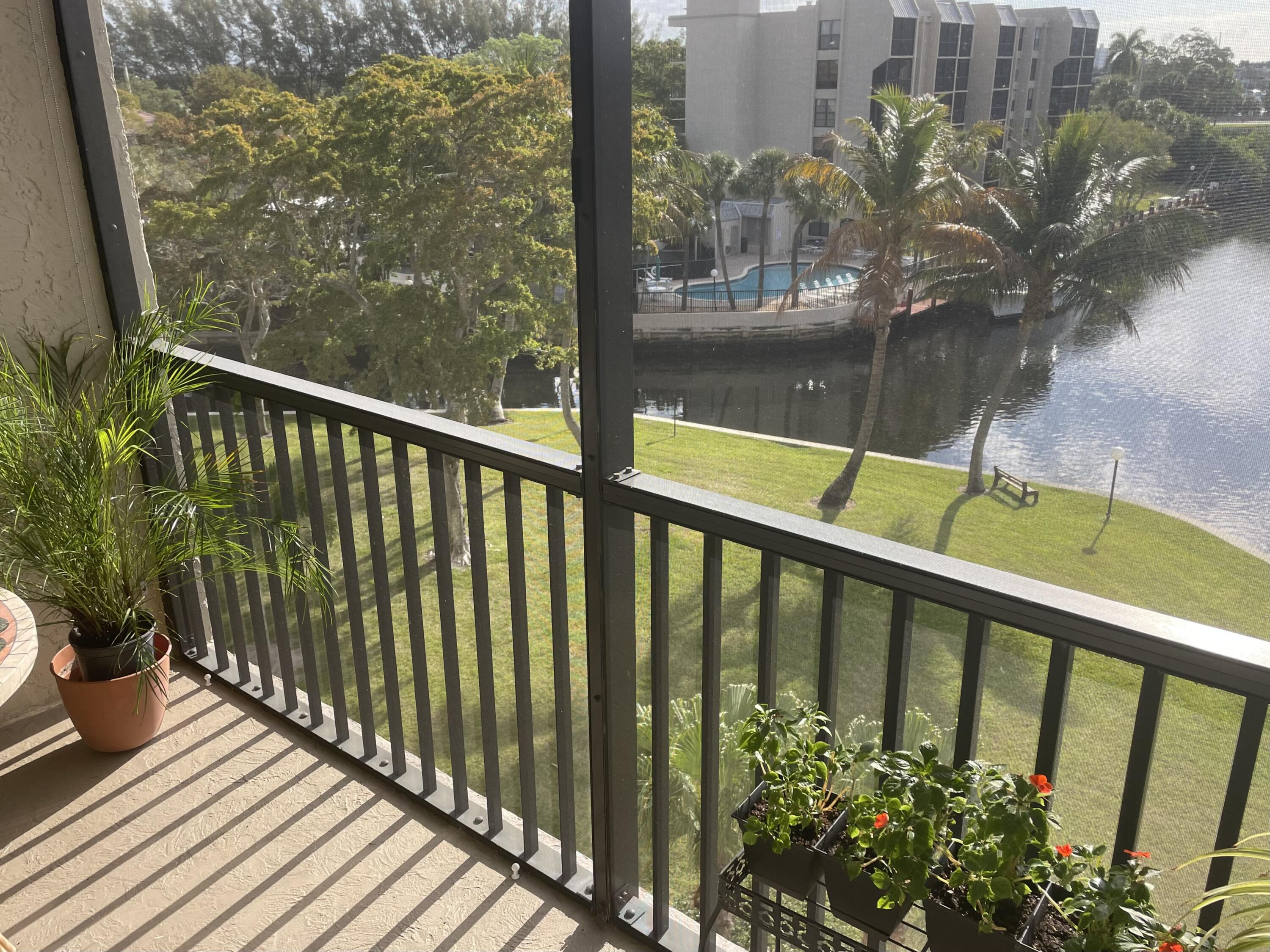 7 Royal Palm Way, Unit 507 Boca Raton, FL 33432 - Photo 31 of 47 a balcony with wooden floor
