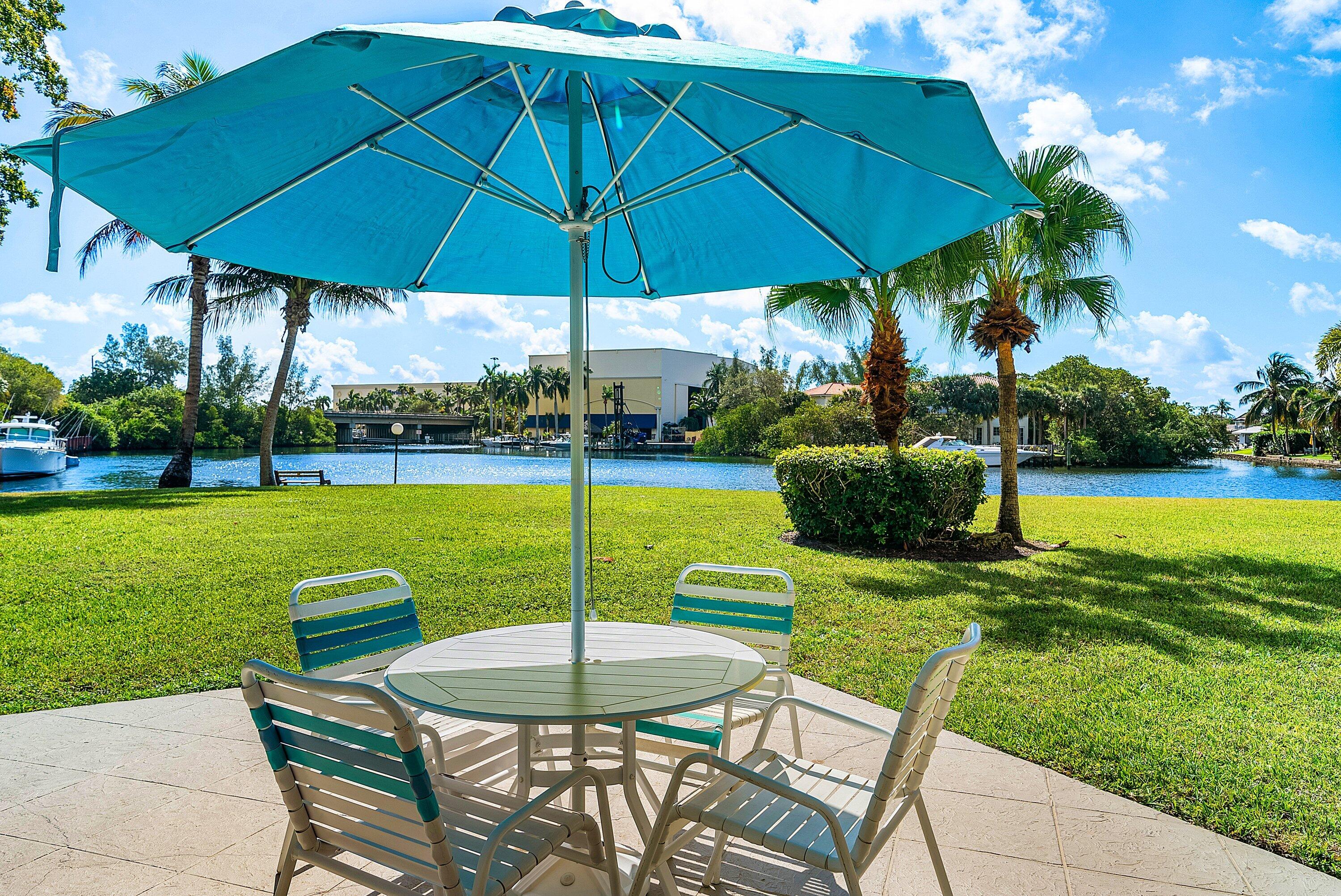 7 Royal Palm Way, Unit 507 Boca Raton, FL 33432 - Photo 41 of 47 a view of a table and chairs under an umbrella
