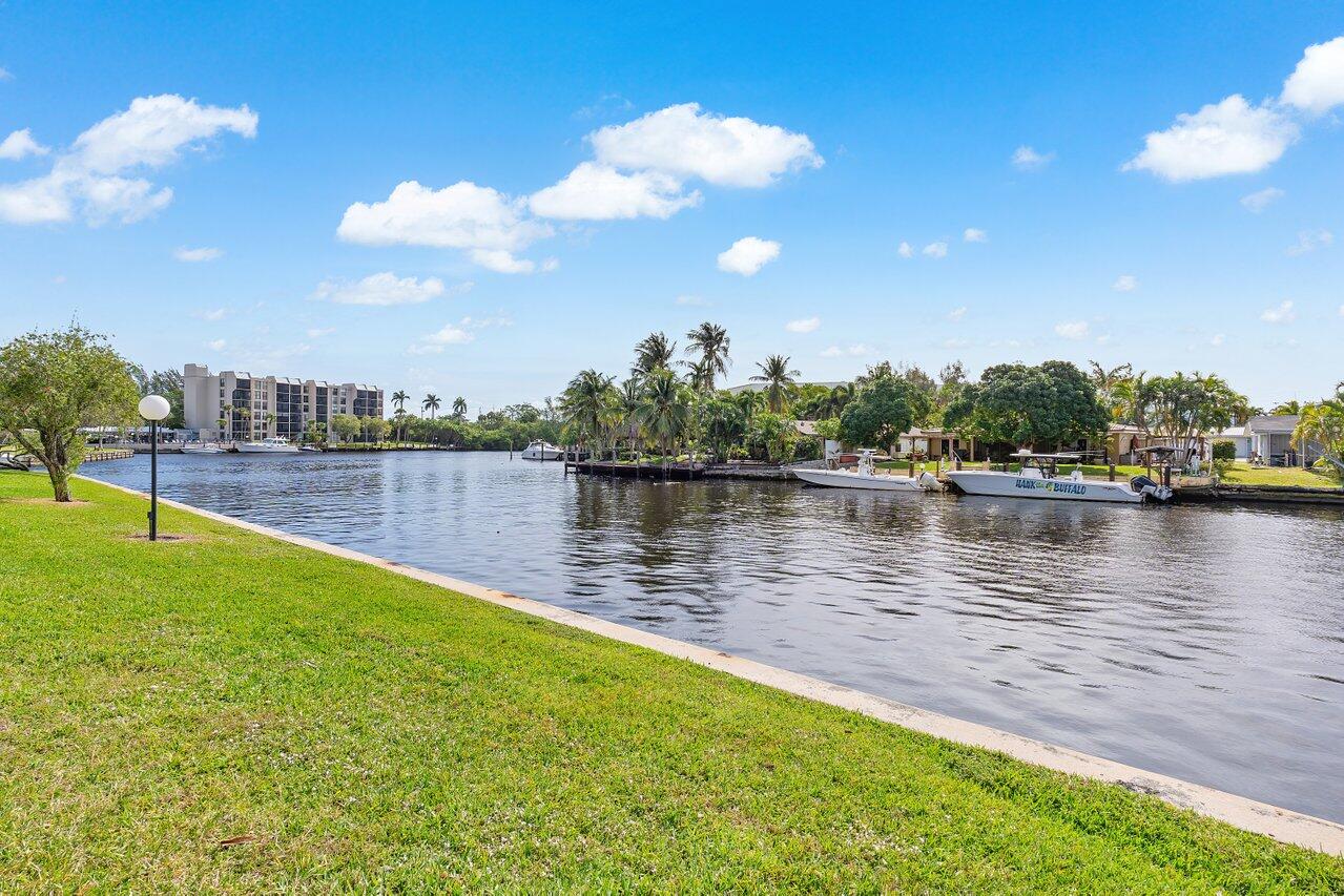 7 Royal Palm Way, Unit 507 Boca Raton, FL 33432 - Photo 42 of 47 a view of a lake with houses in the back