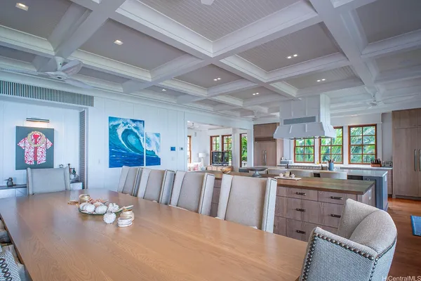 a large living room with stainless steel appliances