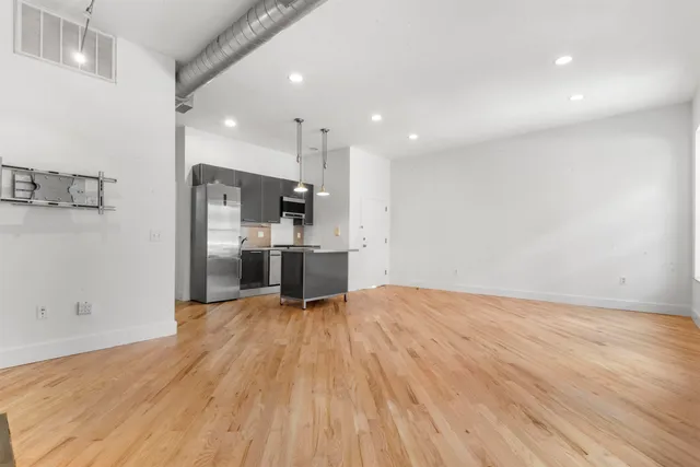 a view of kitchen with wooden floor