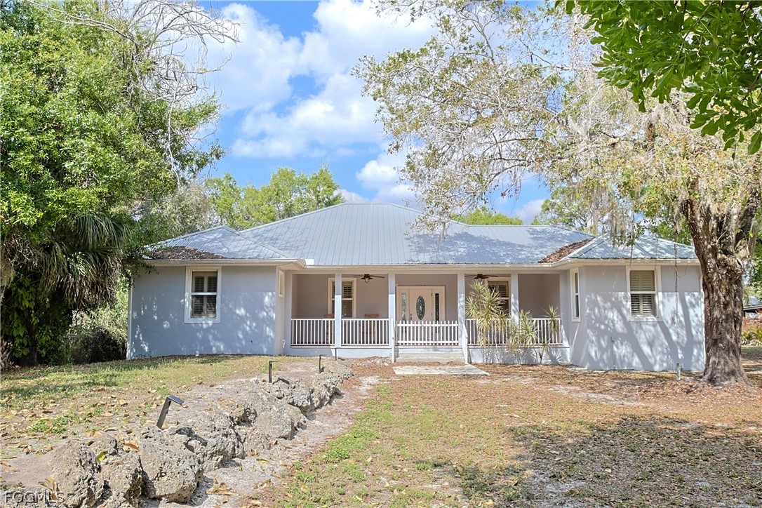 21531 Pearl Street Alva, FL 33920 - Photo 1 of 41 a front view of a house with a yard
