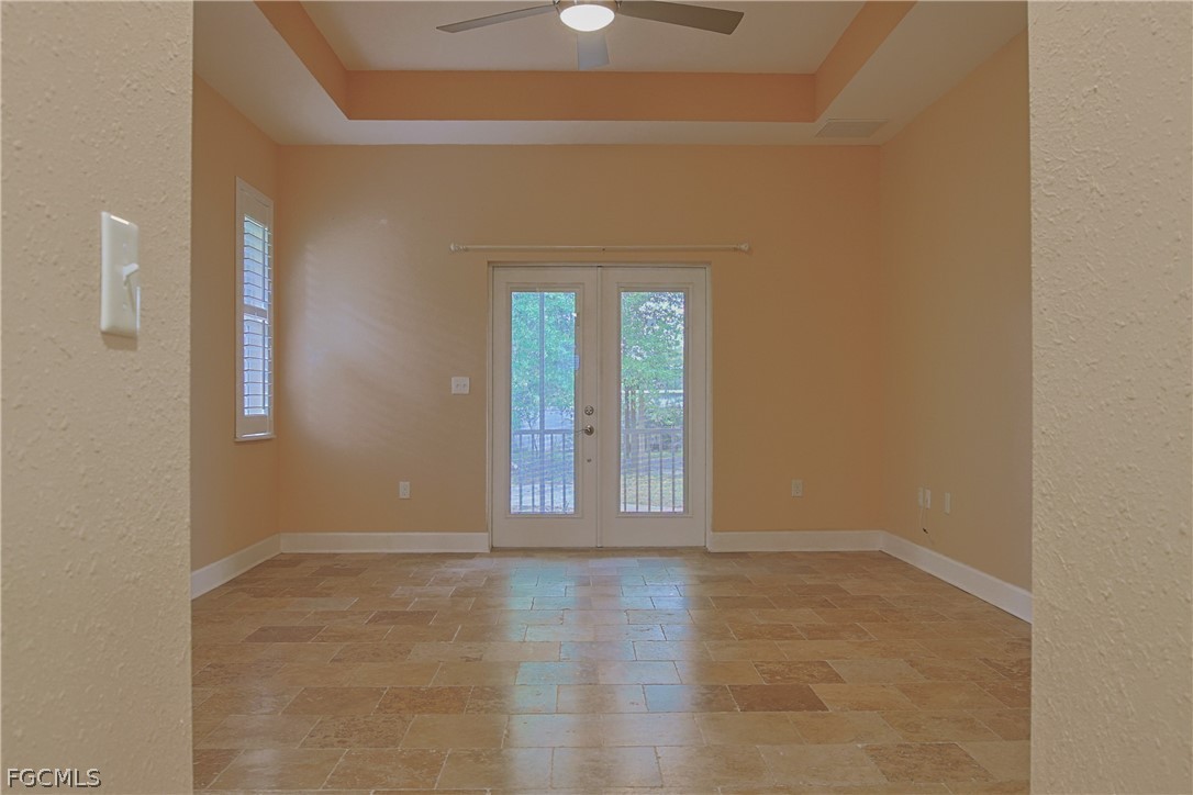 21531 Pearl Street Alva, FL 33920 - Photo 15 of 41 an empty room with wooden floor and windows