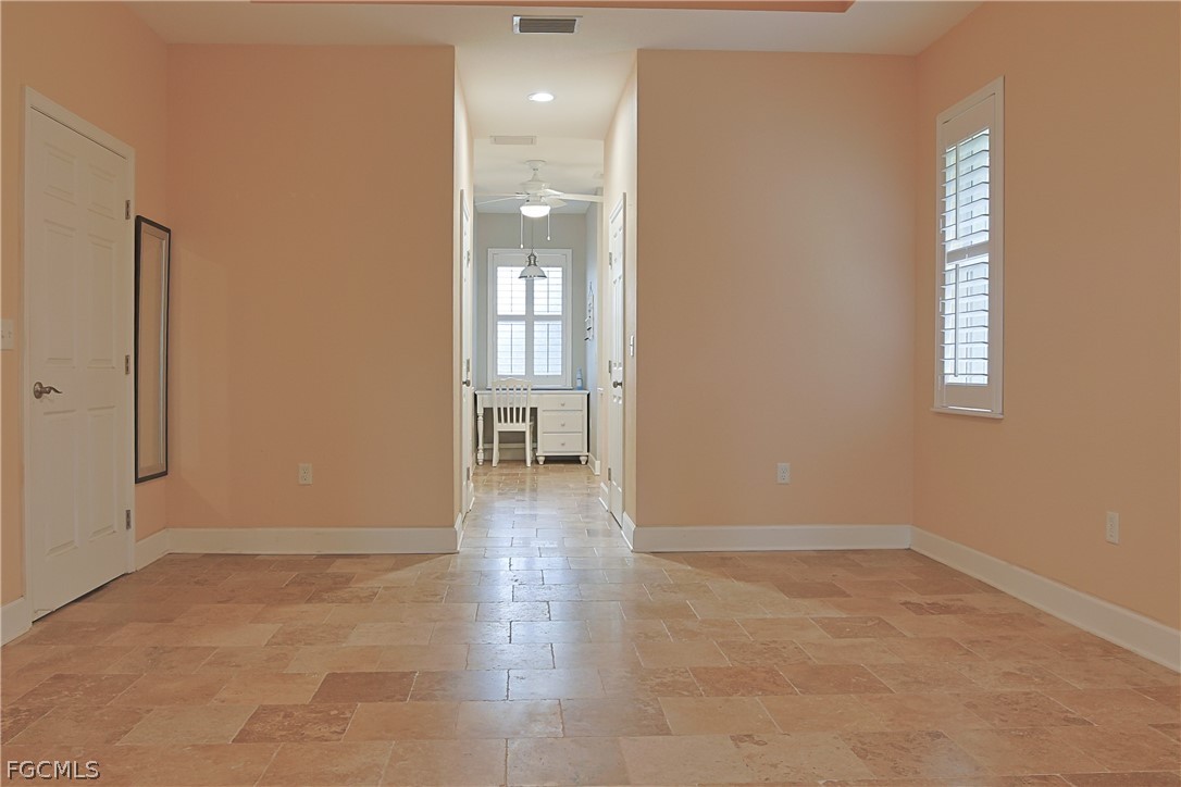 21531 Pearl Street Alva, FL 33920 - Photo 16 of 41 an empty room with windows and entrance