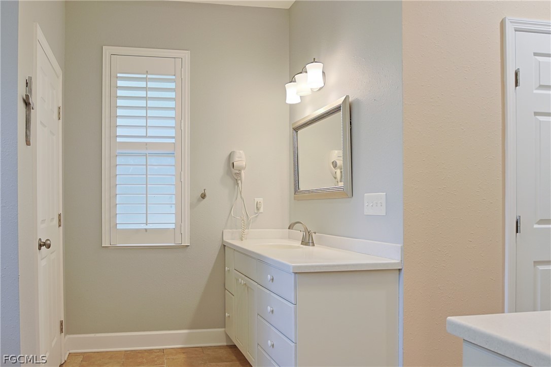 21531 Pearl Street Alva, FL 33920 - Photo 19 of 41 a bathroom with a sink vanity and a mirror