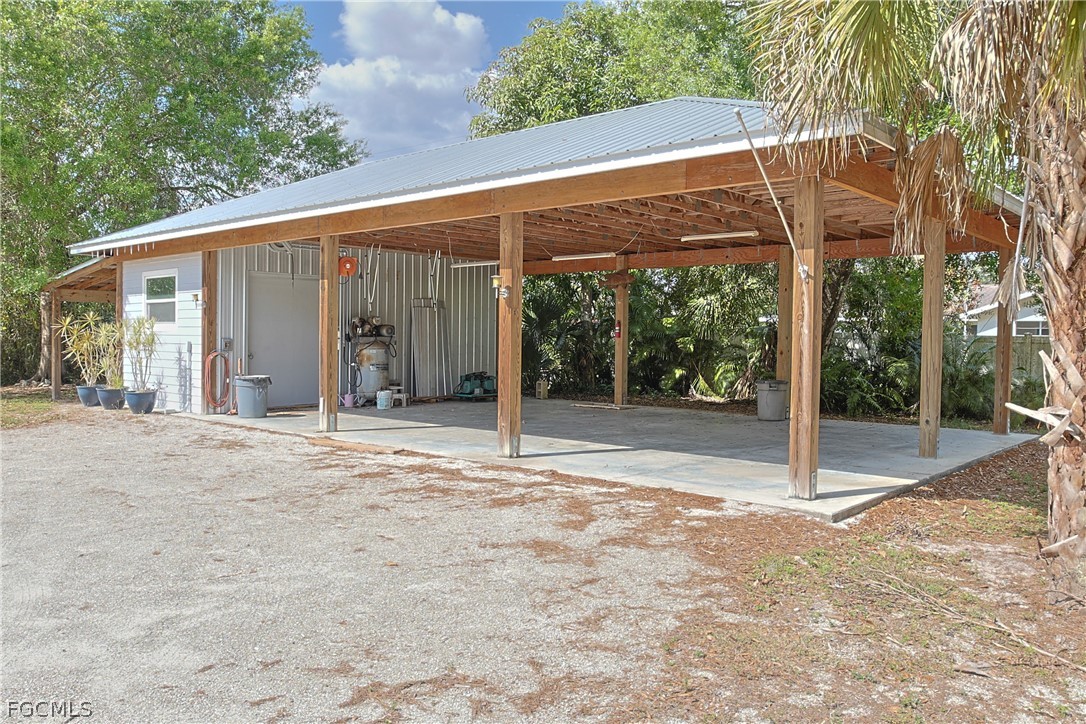 21531 Pearl Street Alva, FL 33920 - Photo 28 of 41 a view of a house with backyard and a porch