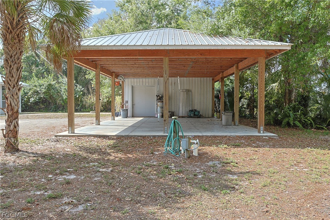 21531 Pearl Street Alva, FL 33920 - Photo 29 of 41 a backyard of a house with a tree