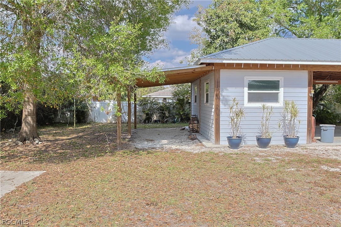 21531 Pearl Street Alva, FL 33920 - Photo 30 of 41 a view of a house with a yard and tree