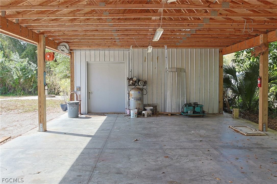 21531 Pearl Street Alva, FL 33920 - Photo 31 of 41 a backyard of a house with garden and plants