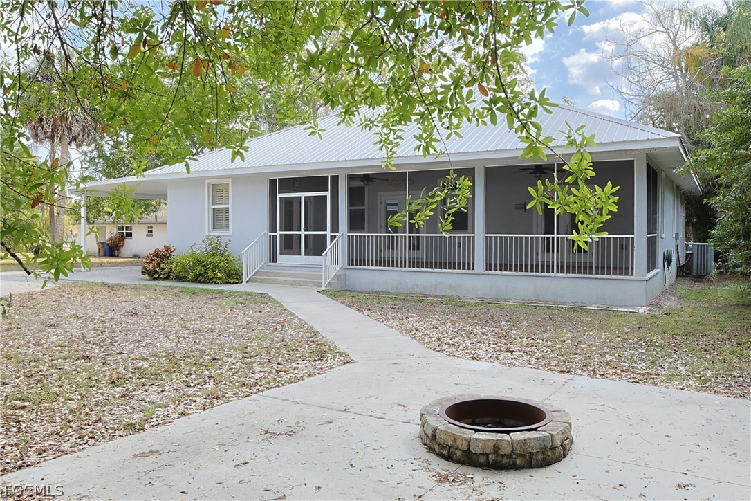 21531 Pearl Street Alva, FL 33920 - Photo 33 of 41 a front view of a house with garden