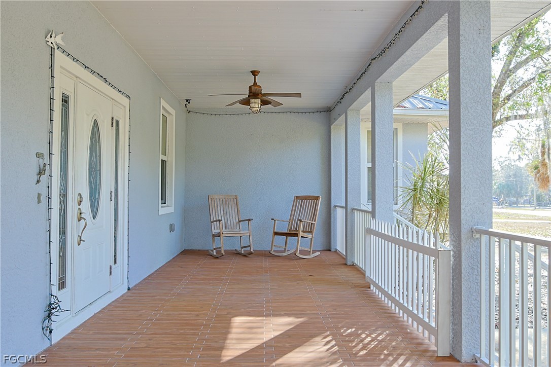 21531 Pearl Street Alva, FL 33920 - Photo 6 of 41 a view of a hallway to a livingroom with furniture