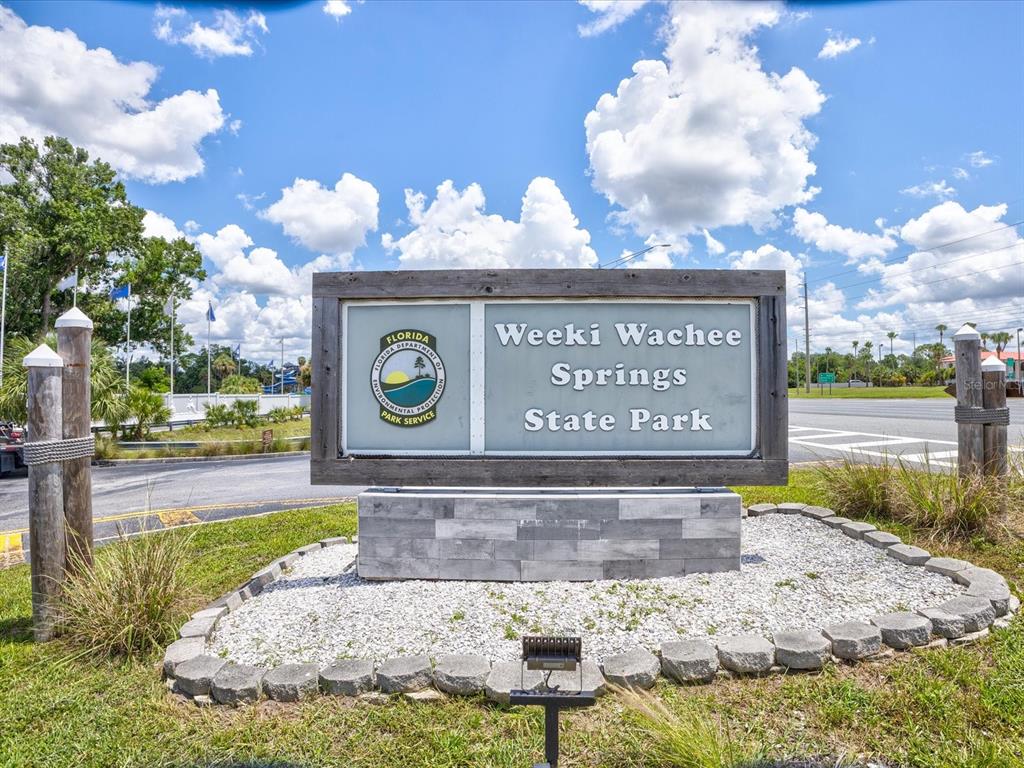 11981 Robina Road Weeki Wachee, FL 34614 - Photo 78 of 93 a view of a street with sign board