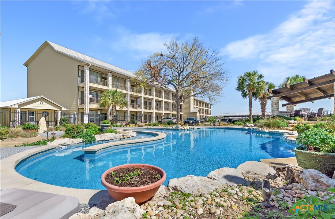 130 Sobrante Road, Unit 209 Belton, TX 76513 - Photo 1 of 36 a view of a swimming pool with a patio