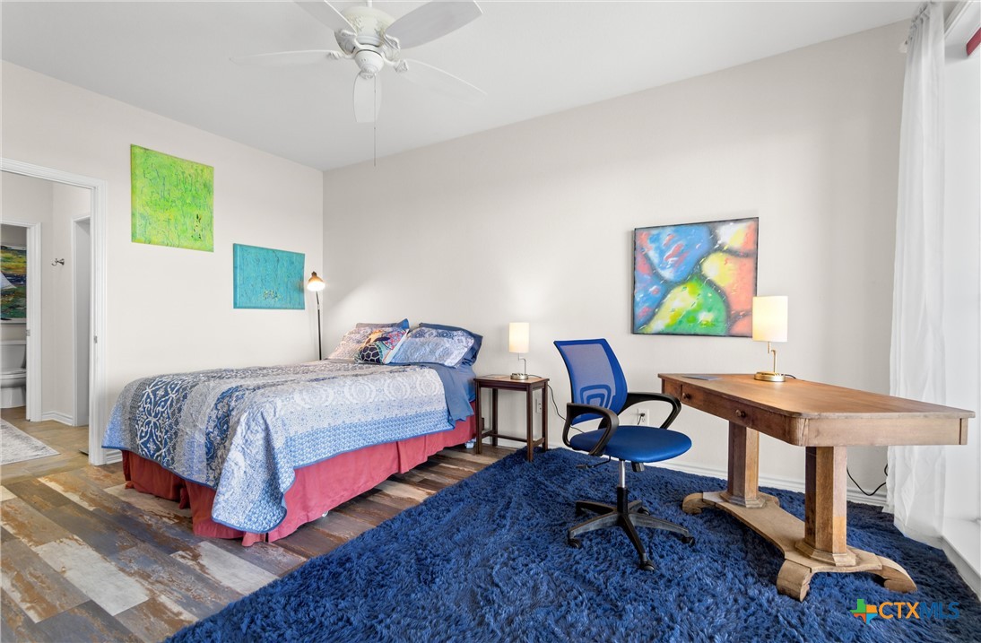 130 Sobrante Road, Unit 209 Belton, TX 76513 - Photo 13 of 36 a bedroom with a bed a desk and chair with it