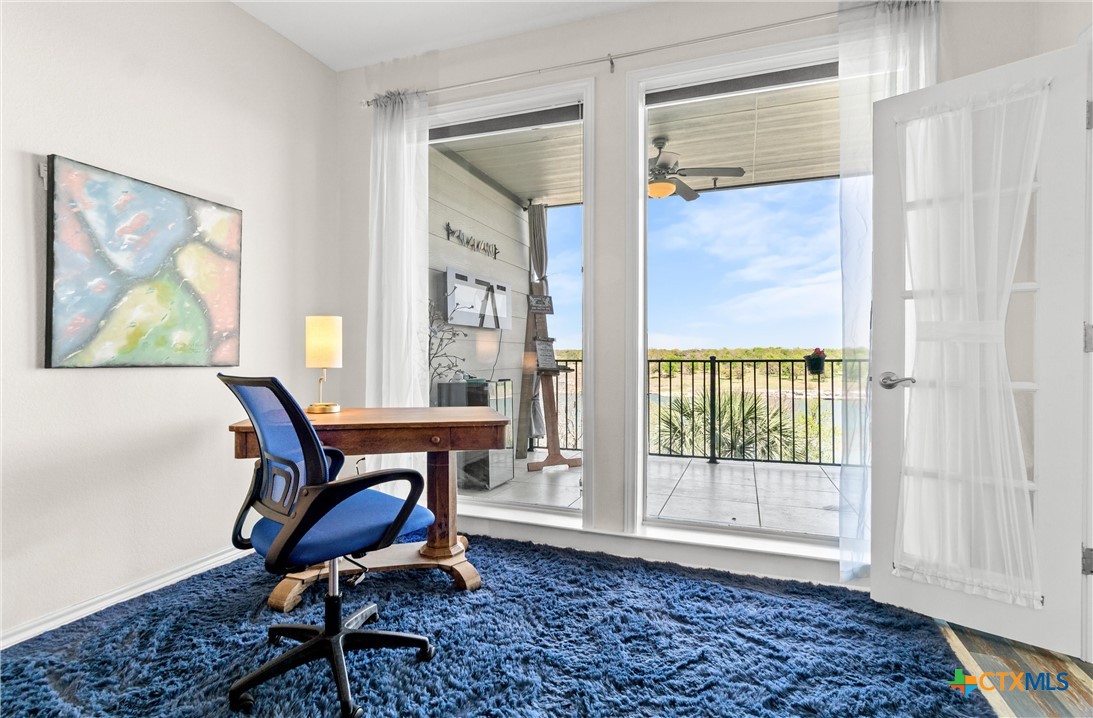 130 Sobrante Road, Unit 209 Belton, TX 76513 - Photo 15 of 36 a workspace room with furniture and wooden floor