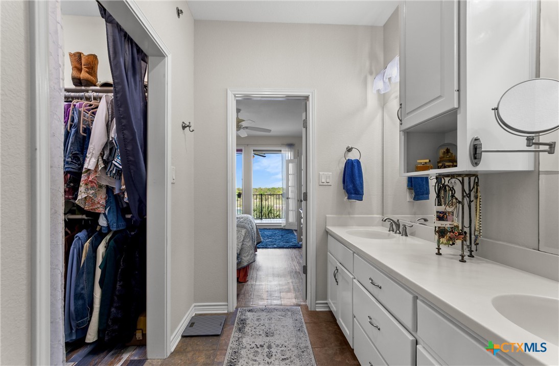 130 Sobrante Road, Unit 209 Belton, TX 76513 - Photo 18 of 36 a bathroom with a double vanity sink and a mirror