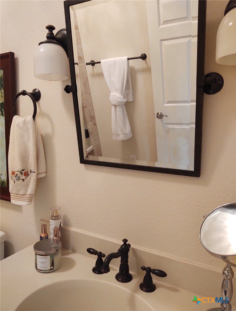 130 Sobrante Road, Unit 209 Belton, TX 76513 - Photo 26 of 36 a bathroom with a sink and mirror