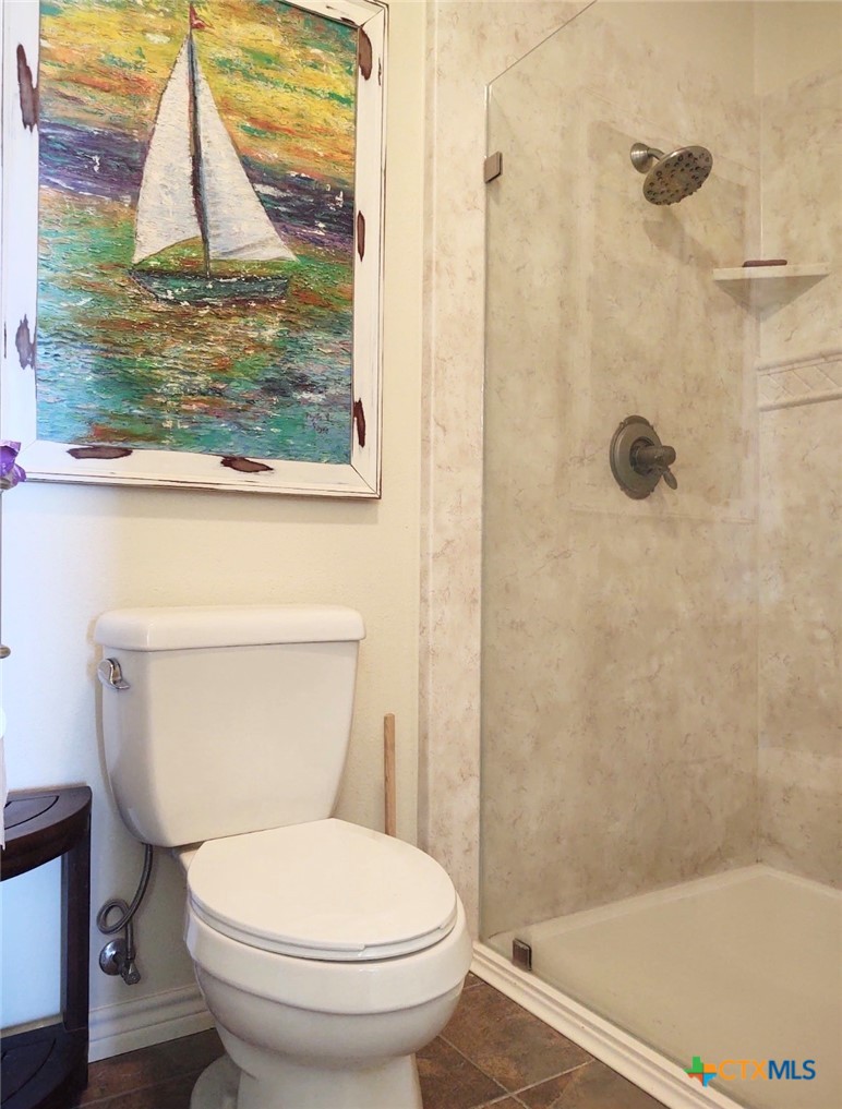 130 Sobrante Road, Unit 209 Belton, TX 76513 - Photo 27 of 36 a bathroom with a toilet and a shower
