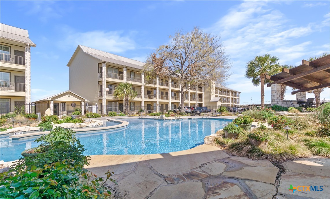 130 Sobrante Road, Unit 209 Belton, TX 76513 - Photo 4 of 36 a view of a house with a swimming pool