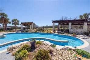 130 Sobrante Road, Unit 209 Belton, TX 76513 - Photo 5 of 36 a view of a swimming pool with a patio