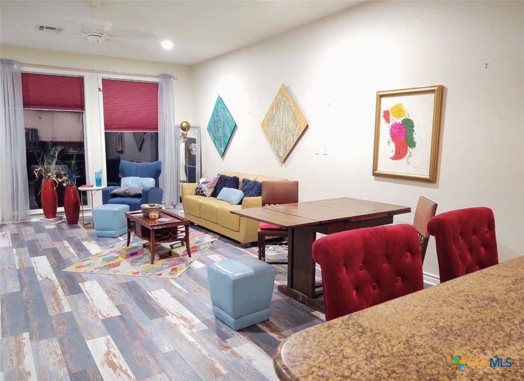 130 Sobrante Road, Unit 209 Belton, TX 76513 - Photo 7 of 36 a living room with furniture a lamp and a window