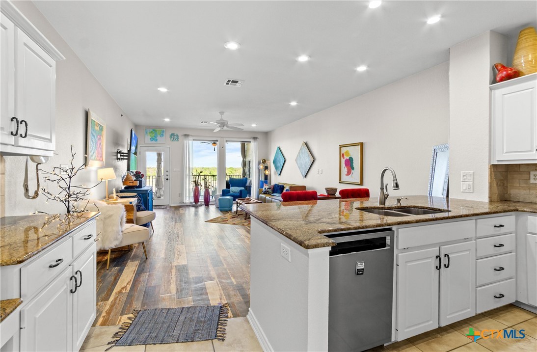 130 Sobrante Road, Unit 209 Belton, TX 76513 - Photo 8 of 36 a kitchen with counter top space sink stove and cabinets