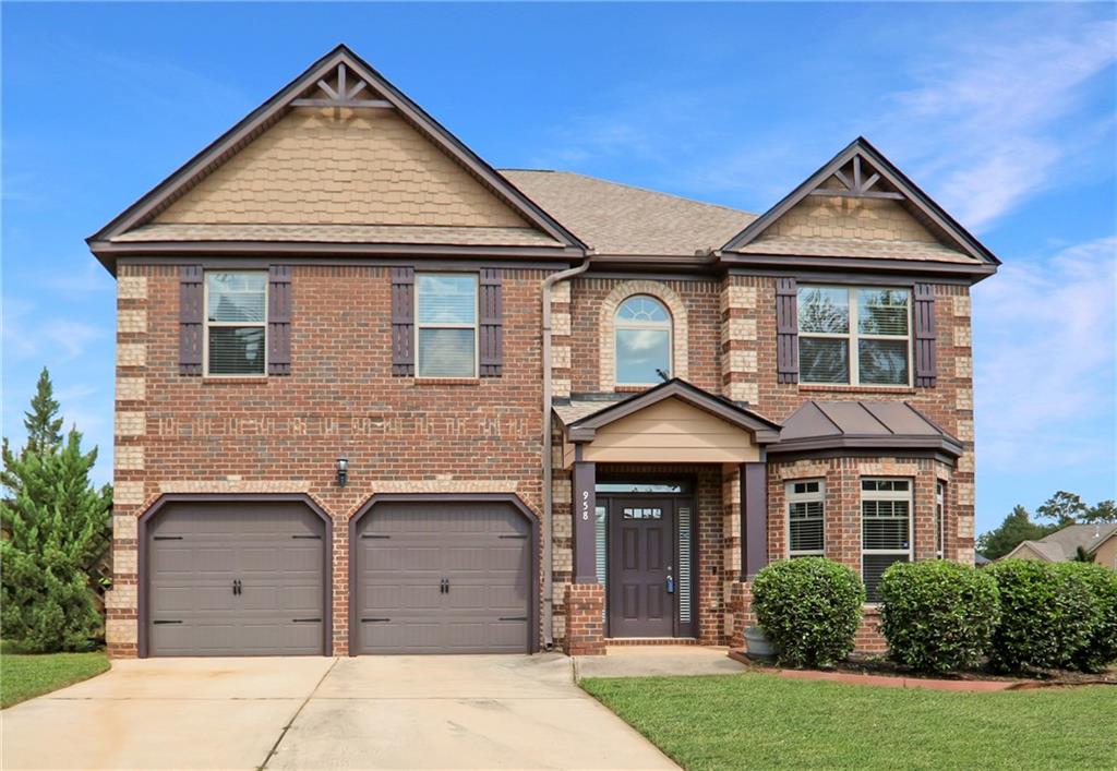 958 Nevis Way McDonough, GA 30253 - Photo 1 of 1 front view of a house with a yard