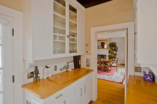 a room with sink and cabinets