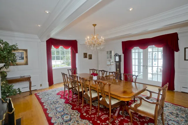 a view of a dining room with furniture and window