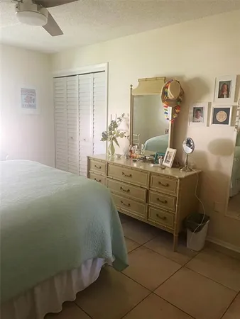 a bed room with a bed and a dresser