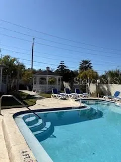 a view of a patio with swimming pool