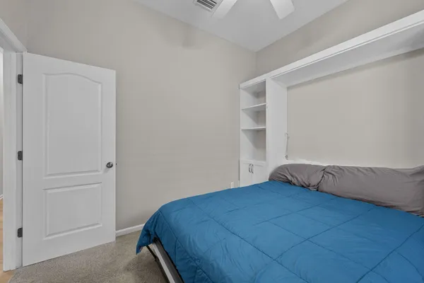 a bedroom with a bed and closet