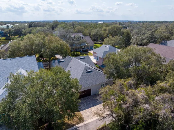 an aerial view of a house with a lake view