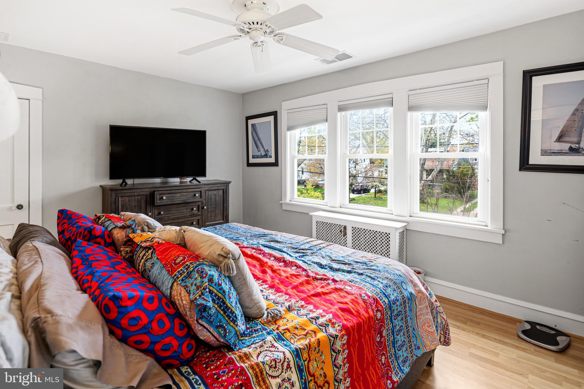 256 Hawthorne Avenue Haddonfield, NJ 08033 - Photo 13 of 17 a bedroom with a bed and a flat screen tv