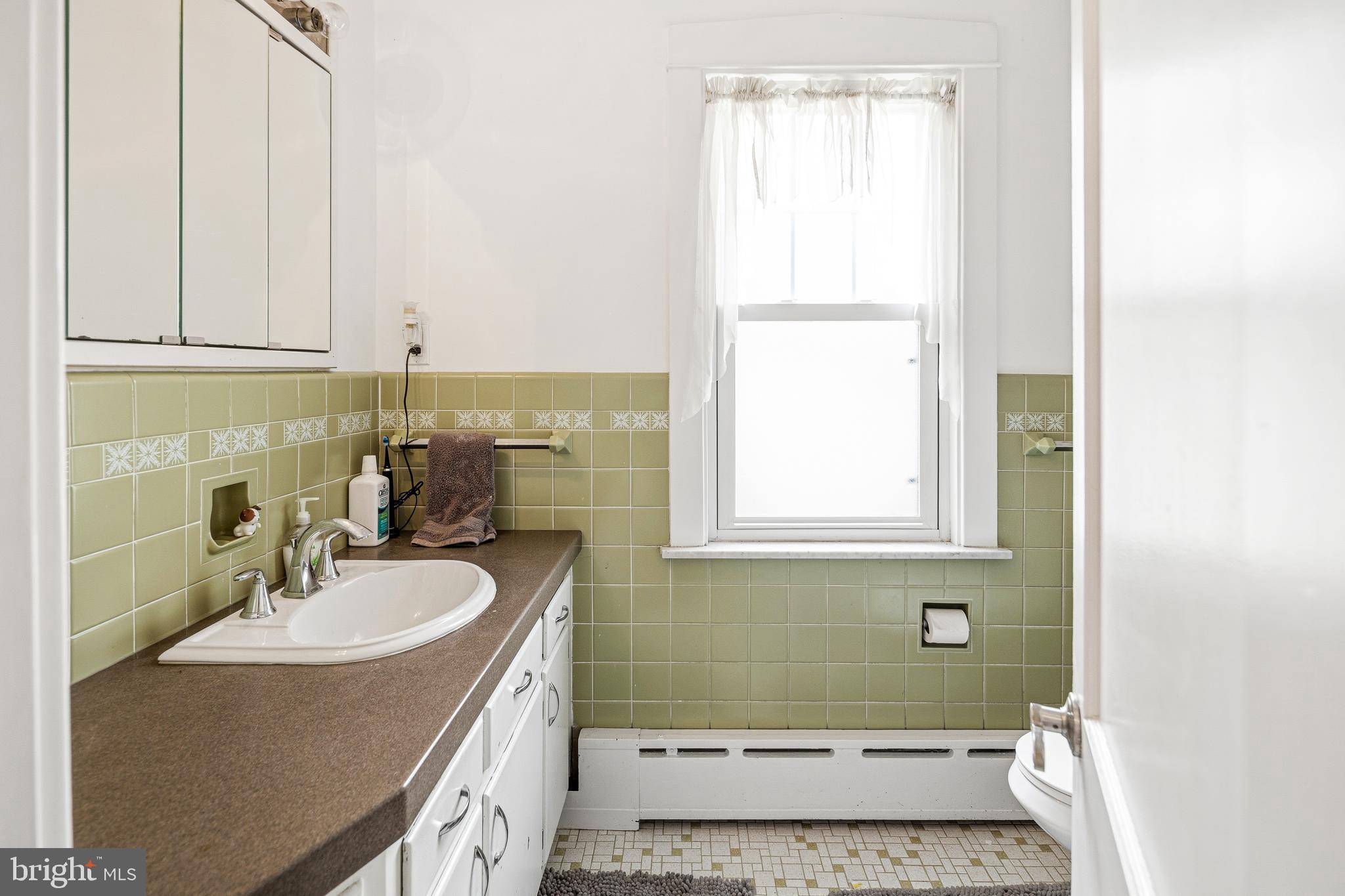 256 Hawthorne Avenue Haddonfield, NJ 08033 - Photo 14 of 17 a bathroom with a sink and a mirror
