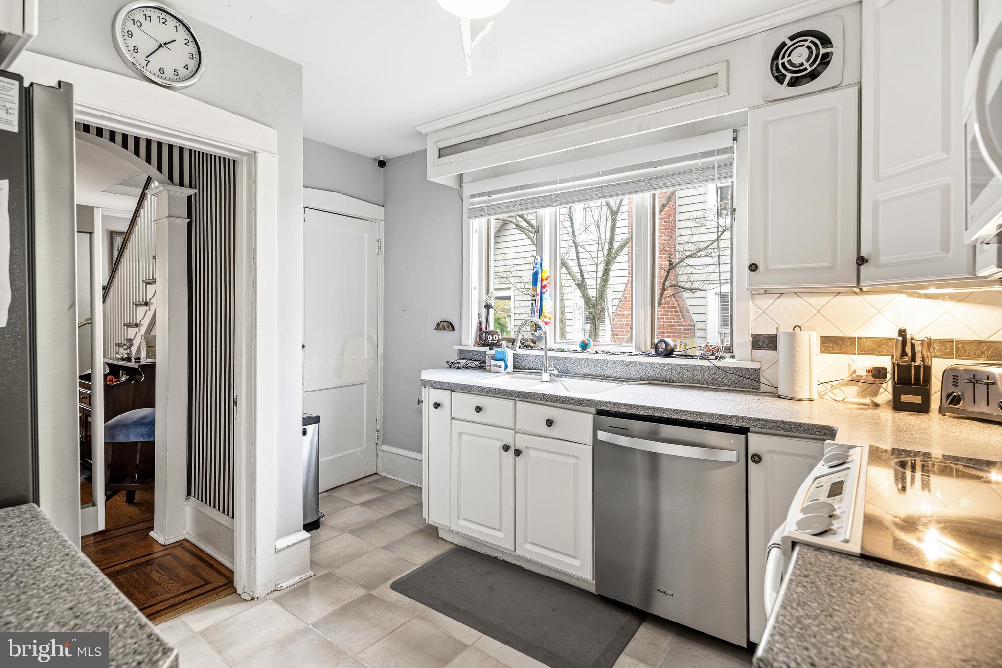 256 Hawthorne Avenue Haddonfield, NJ 08033 - Photo 8 of 17 a kitchen with a sink and a refrigerator