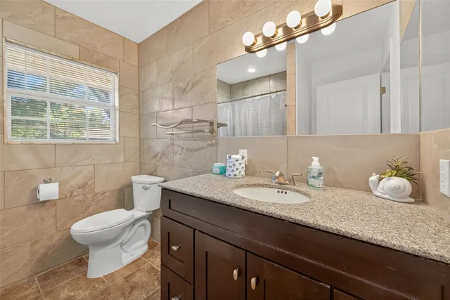 a view of a backyard with table and chairs