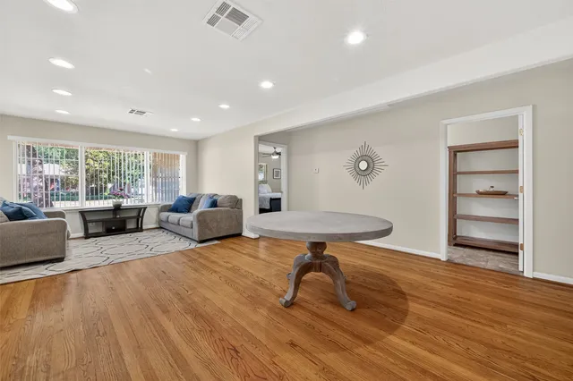 a view of a livingroom with furniture and wooden floor