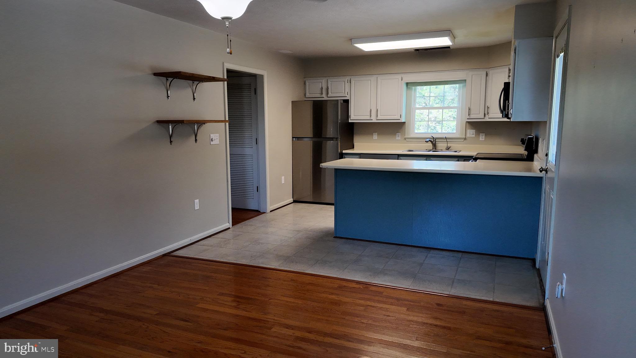 1185 Kesler Road Front Royal, VA 22630 - Photo 21 of 51 a kitchen with granite countertop a refrigerator and a stove top oven